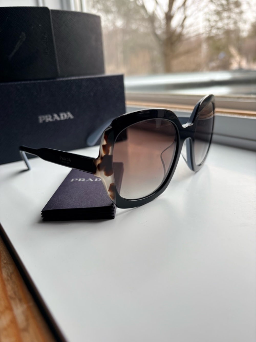 Prada Women's Black Frame Sunglasses with Tortoiseshell Temples